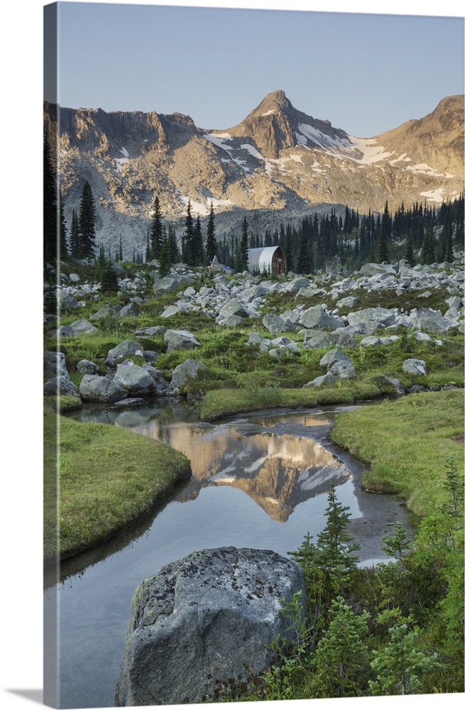 Mountains reflected in creek, subalpine meadows of Marriott Basin, Coast Mountains, British Columbia