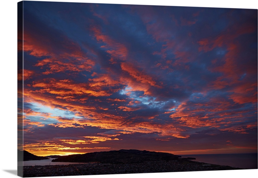 Sunrise over Otago harbor and Pacific Ocean, Dunedin, South Island, New Zealand.