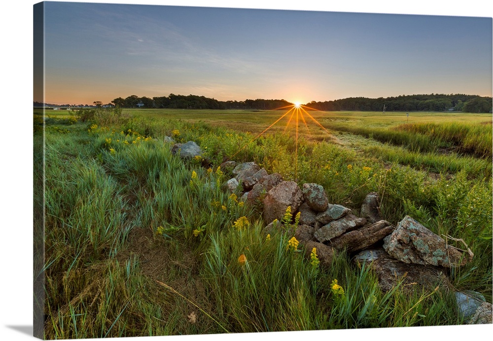 Sunrise over the salt marsh along the Essex River at the Cox Reservation in Essex, Maassachusetts.