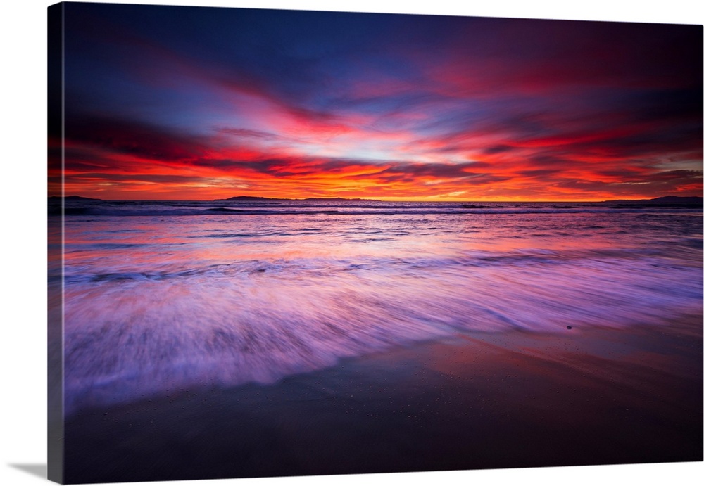 Sunset over the Channel Islands from San Buenaventura State Beach, Ventura, California USA.