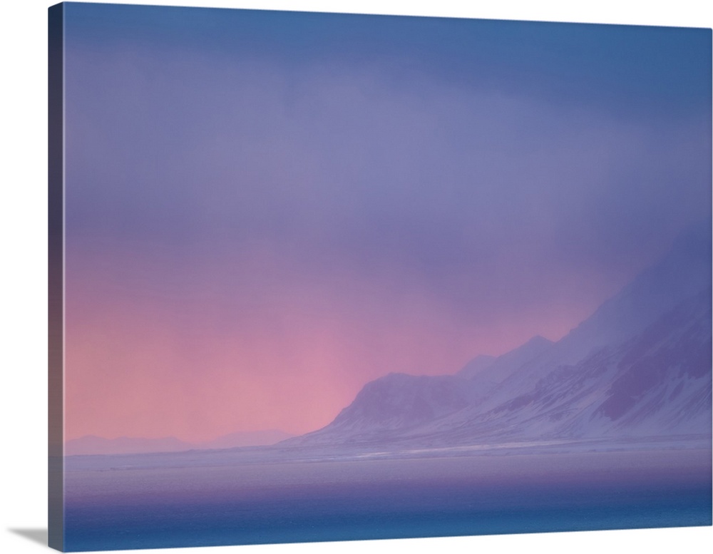 Sunset over the Isfjorden during winter on the island of Spitsbergen in the Svalbard Archipelago. Arctic, Norway.