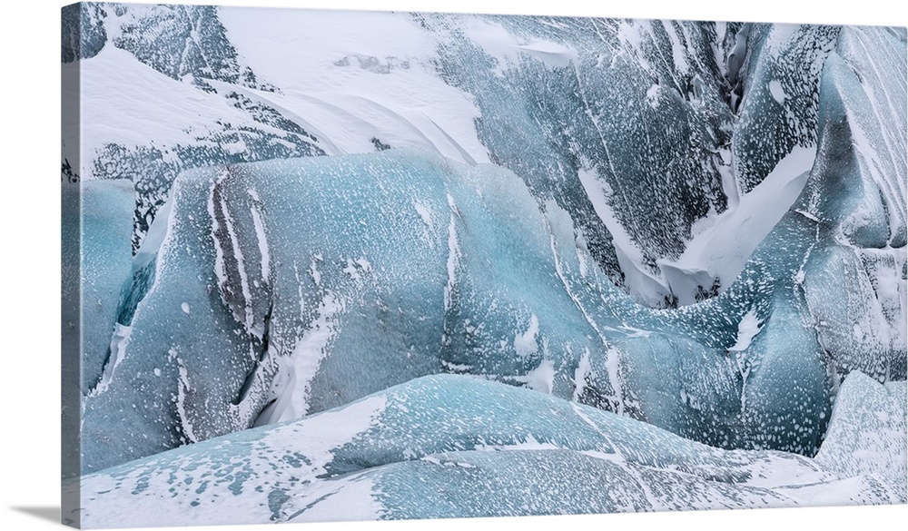 Svinafellsjoekull Glacier in Vatnajokull during winter. Glacier front and Icefall..