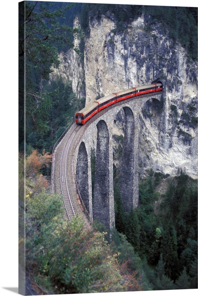 Europe, Switzerland, Bernina Region, passenger train on the tallest rock bridge in Switzerland