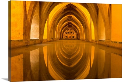 The Arches Of The Interior Of The Baths Reflect In The Calm Water In The Alcazar, Spain
