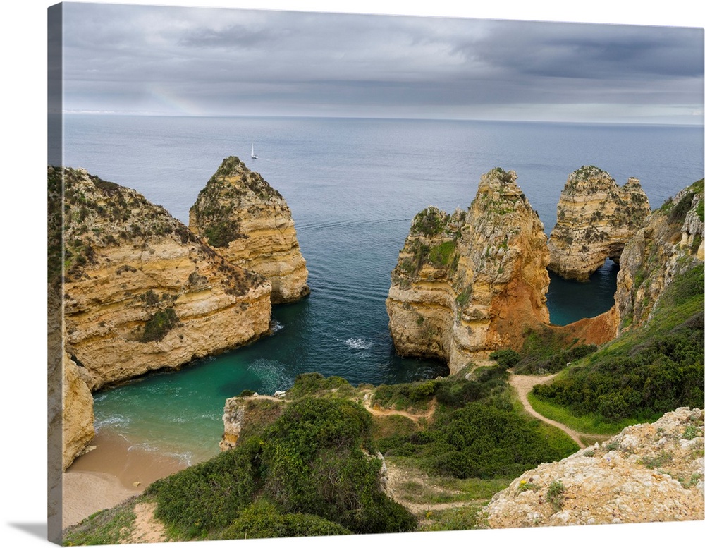 The cliffs and sea stacks of Ponta da Piedade at the rocky coast of the Algarve in Portugal. Europe, Southern Europe, Port...