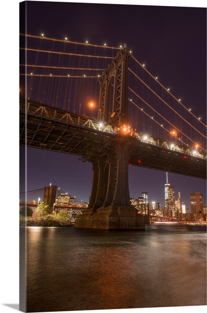 The Manhattan Bridge and Manhattan skyline in the evening light from Brooklyn Bridge Park, New York City, New York
