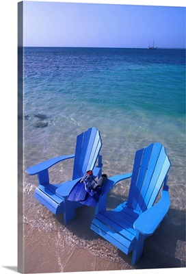 The Perfect Oceanside Caribbean Scene with Chairs in the Water
