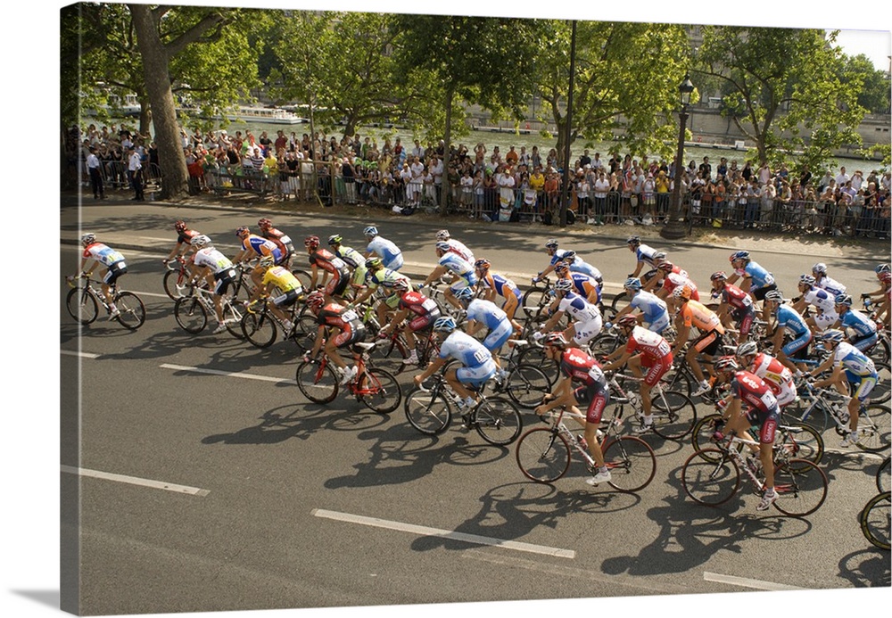 Thousands line the Quai des Tuileries to welcome the peloton in the Tour de France at the finish of the Internationally fa...