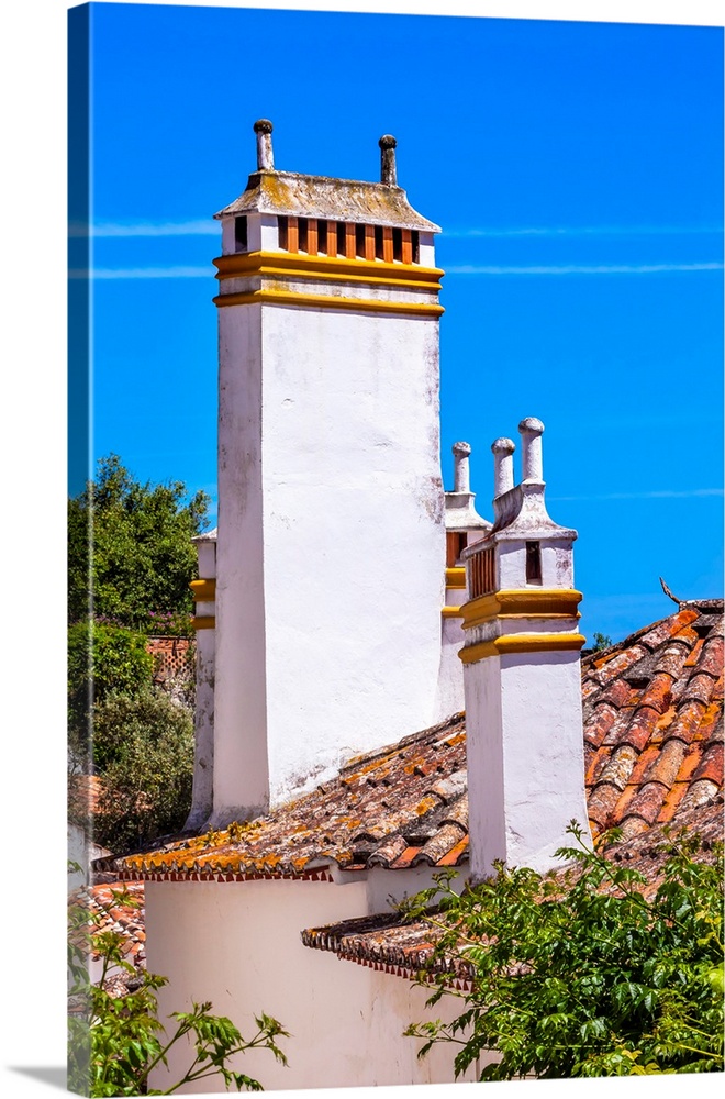 Towers Chimnies Orange Roofs Medieval Town Obidos Portugal. Castle and walls built in 11th century after town taken from t...
