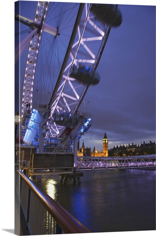 Europe, Great Britain, London. Twilight view of the Clock Tower or Big Ben from the London Eye and moving Ferris wheel.  C...