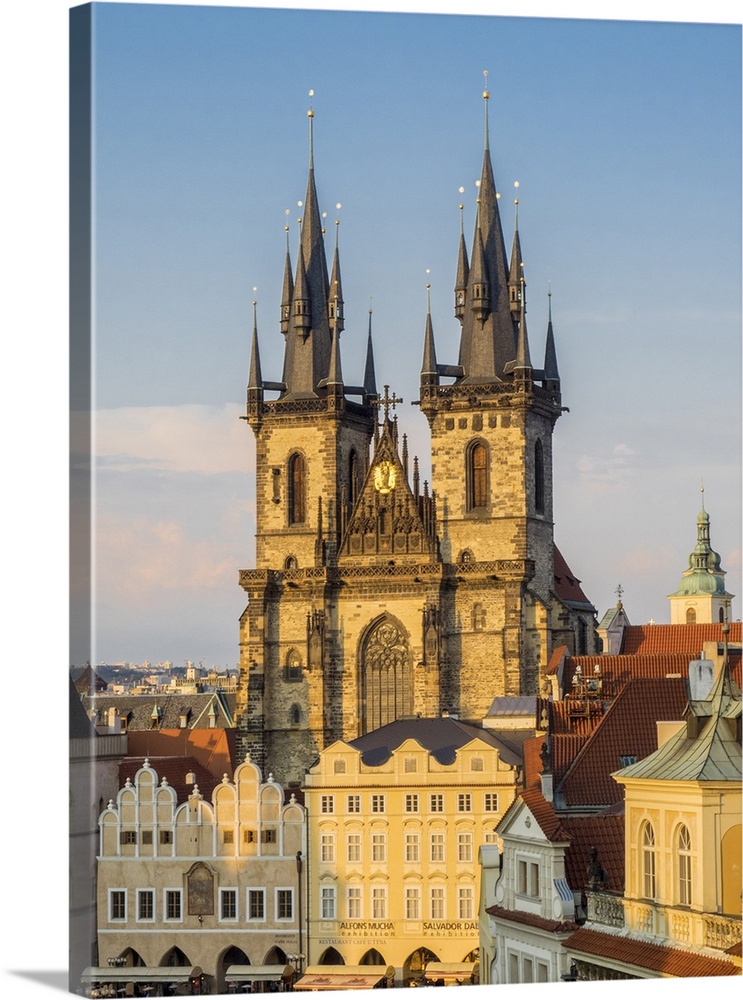 Europe, Czech Republic, Prague.  Tyn Church, founded in 1385, dominates one side of the Old Town Square in Prague. The tow...