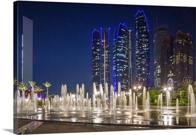 UAE, Abu Dhabi, Emirates Palace Hotel Fountains And Etihad Towers, Dusk