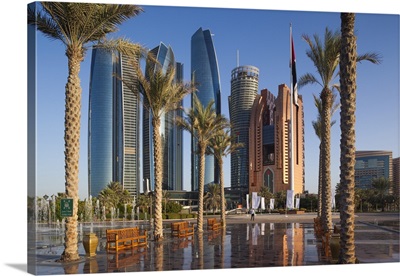 UAE, Abu Dhabi, Etihad Towers And Emirates Palace Hotel Fountains, Dusk