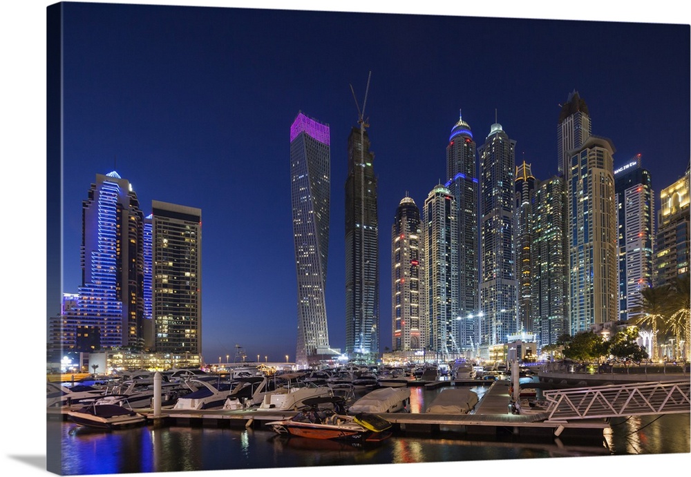 UAE, Dubai, Dubai Marina, high rise buildings including the twisted Cayan Tower, dusk