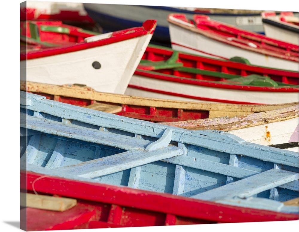 Colorful traditional fishing boats at the historic waterfront. Cidade Velha, historic center of Ribeira Grande, listed as ...