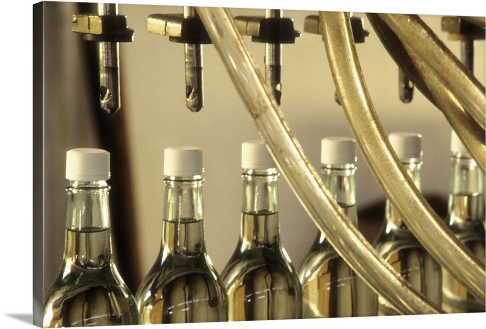 Caribbean: US Virgin Islands, St Croix, detail of bottles along assembly line at Cruzan Rum Distillery