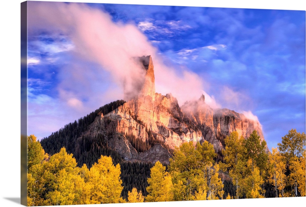 USA, Colorado, San Juan Mountains. Autumn aspen trees and Chimney Rock