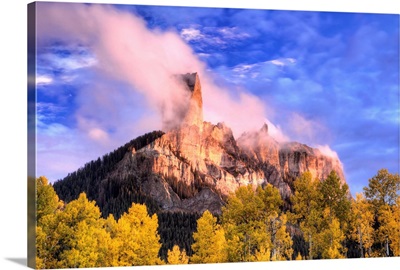 USA, Colorado, San Juan Mountains, Autumn aspen trees and Chimney Rock