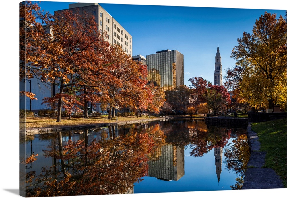 USA, Connecticut, Hartford, Bushnell Park, reflection of office buildings and Travelers Tower, Headquarters of the Travele...