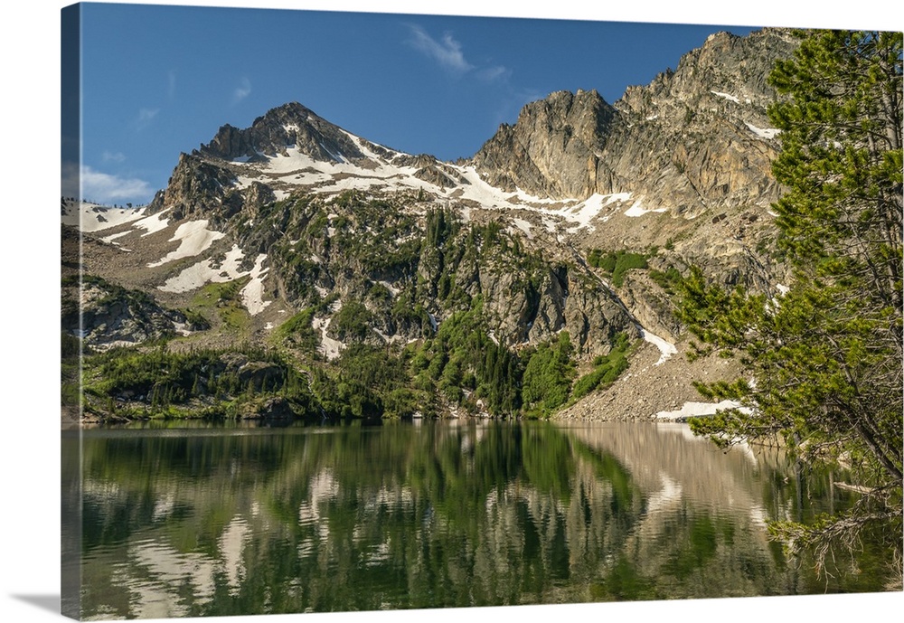 USA, Idaho, Sawtooth Wilderness. Mountain reflects in Alpine Lake.