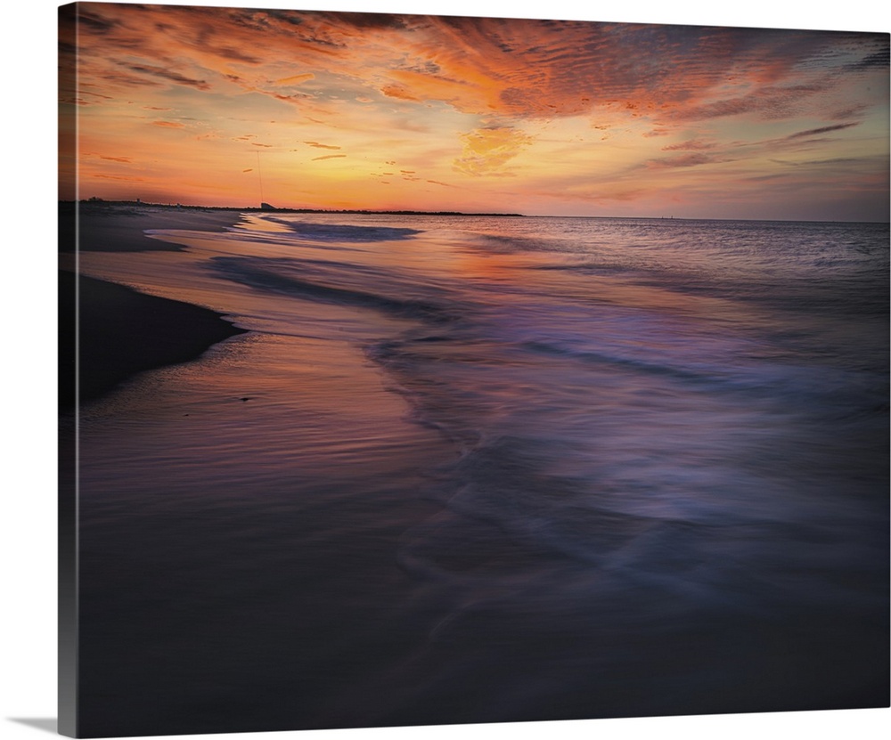 USA, New Jersey, Cape May National Seashore. Sunset on ocean and beach.