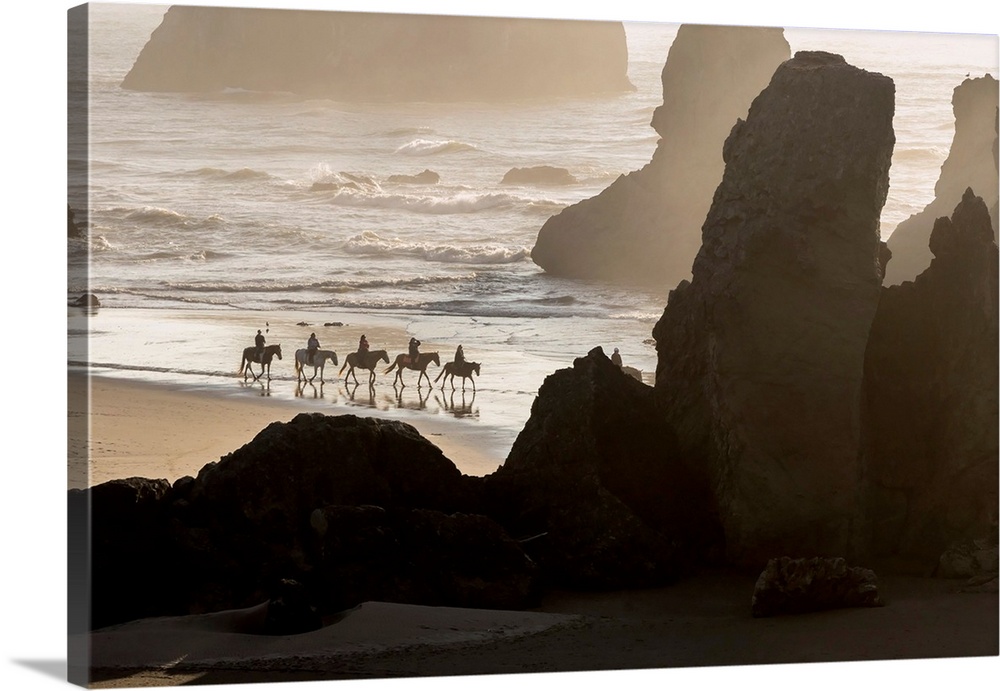 USA, Oregon, Bandon. Horseback riders on beach.