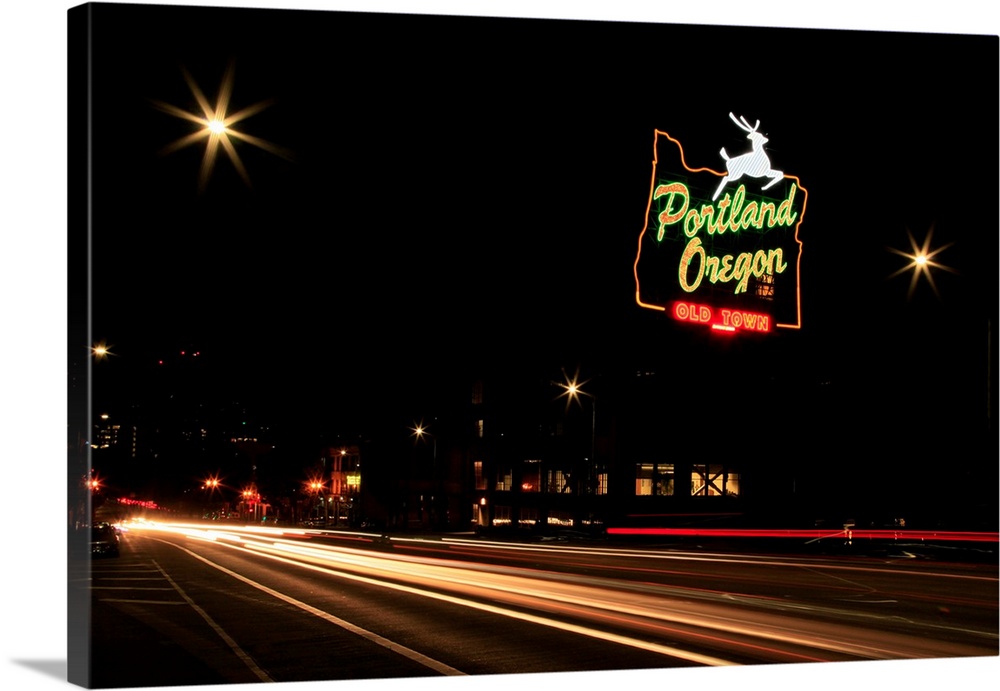USA, Oregon, Portland. Neon sign in Old Town and traffic blur.