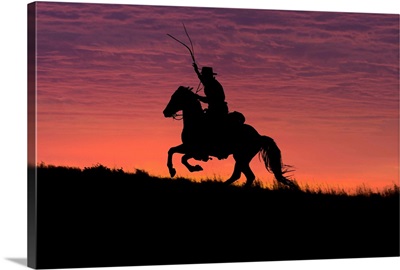 USA, Wyoming, Shell, The Hideout Ranch, Silhouette Of Cowboy And Horse At Sunset