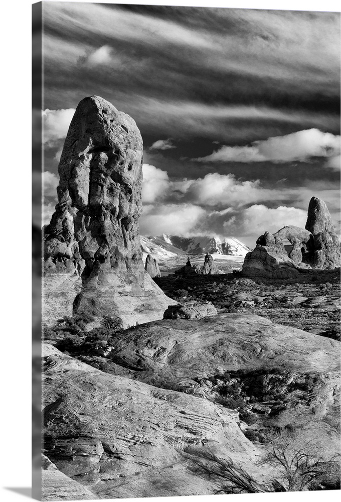 North America, USA, Utah, Arches National Park.  Black and white image of Turret Arch and the LaSal Mountains at sunset wi...