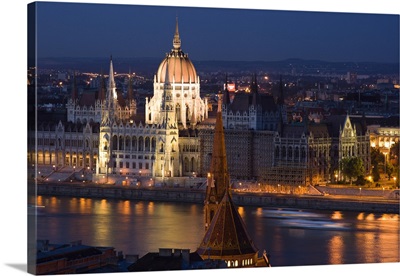 View of Parliament Buildings along Danube River at dusk, Budapest, Capital of Hungary