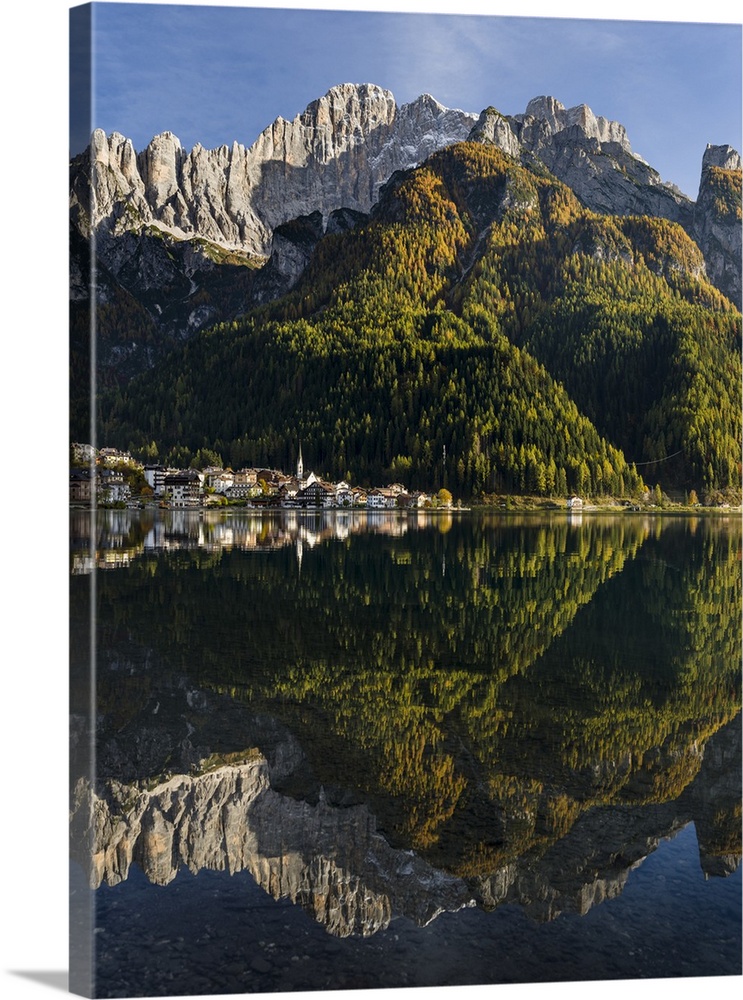 Village Alleghe at Lago di Alleghe at the foot of mount Civetta, one of the icons of the Dolomites of the Veneto. The Dolo...