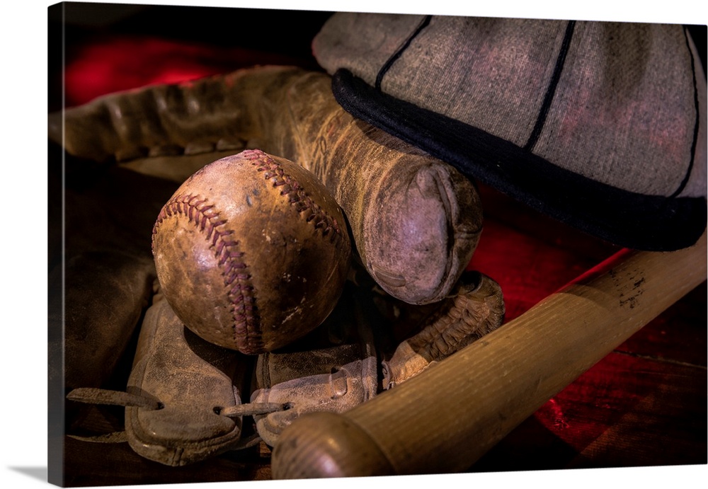 Vintage baseball paraphenalia laid out carefully painted with light.