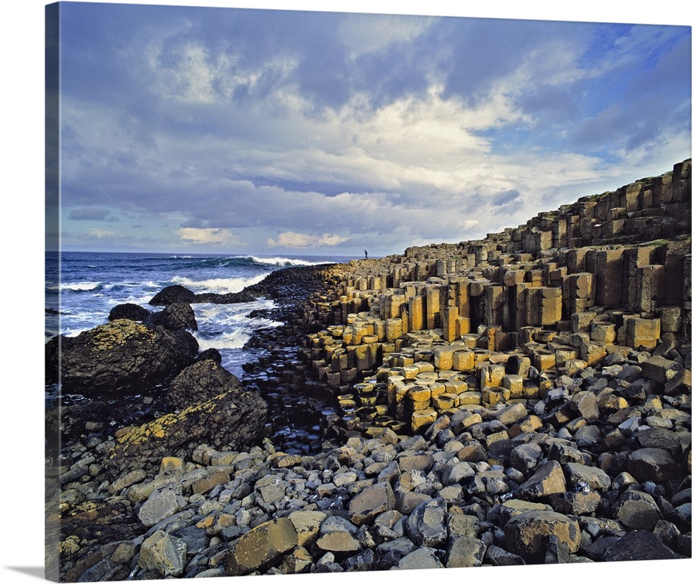 Northern Ireland, County Antrim, Giant's Causeway. Visitors comb the basalt blocks at the Giant's Causeway on the Antrim C...