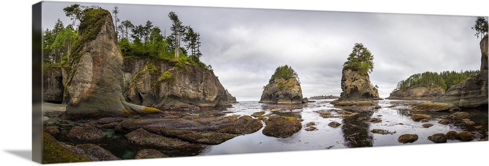 USA, Washington State, Panorama of sea kayakers paddling at Cape Flattery on the Olympic Coast. Digital composite. (MR)