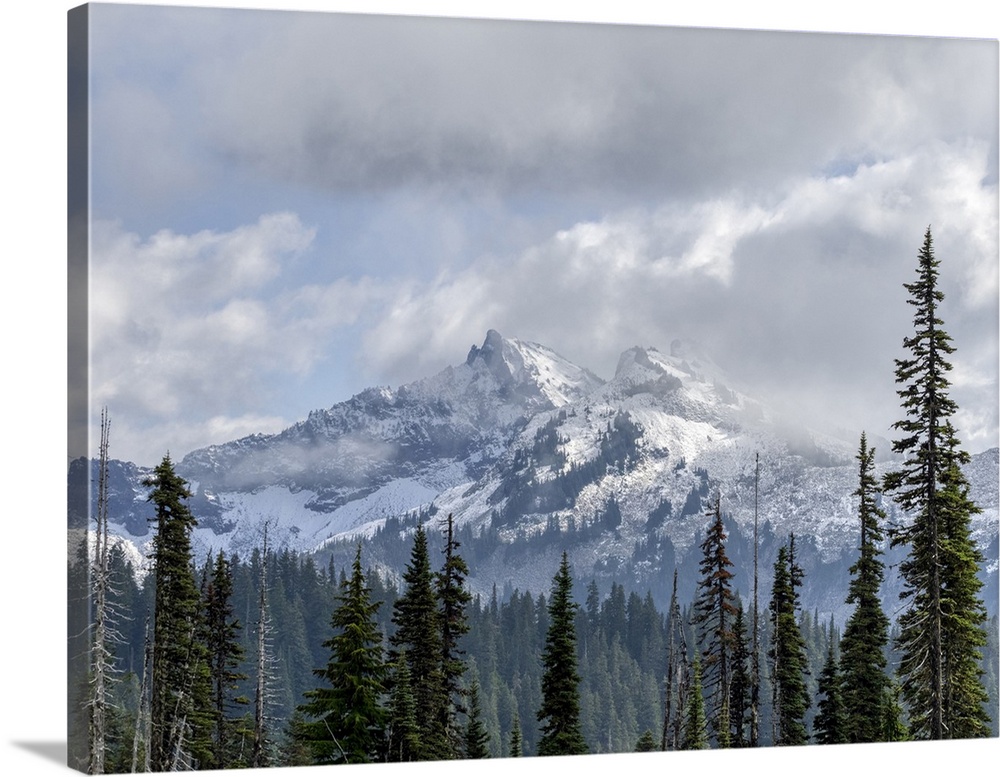 Washington State, Mount Rainier National Park. Tatoosh Range, snow covered peaks and clouds.