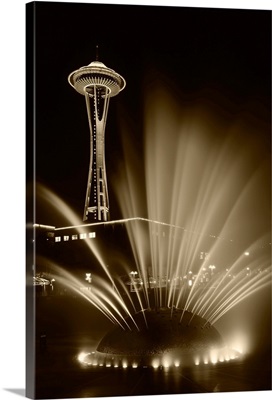 Washington State, Seattle, Space Needle tower with fountain in foreground at night