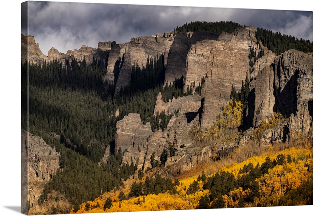 USA, North America, Colorado. West Elk Mountains, Sunrise Storm Clouds Above Mountain And Forest In Autumn.