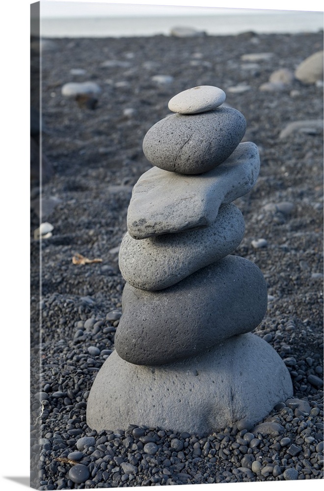 West Iceland, Snaefellsnes Peninsula. Snaefellsjokull National Park, stone cairn at Djupalonssandur Beach.