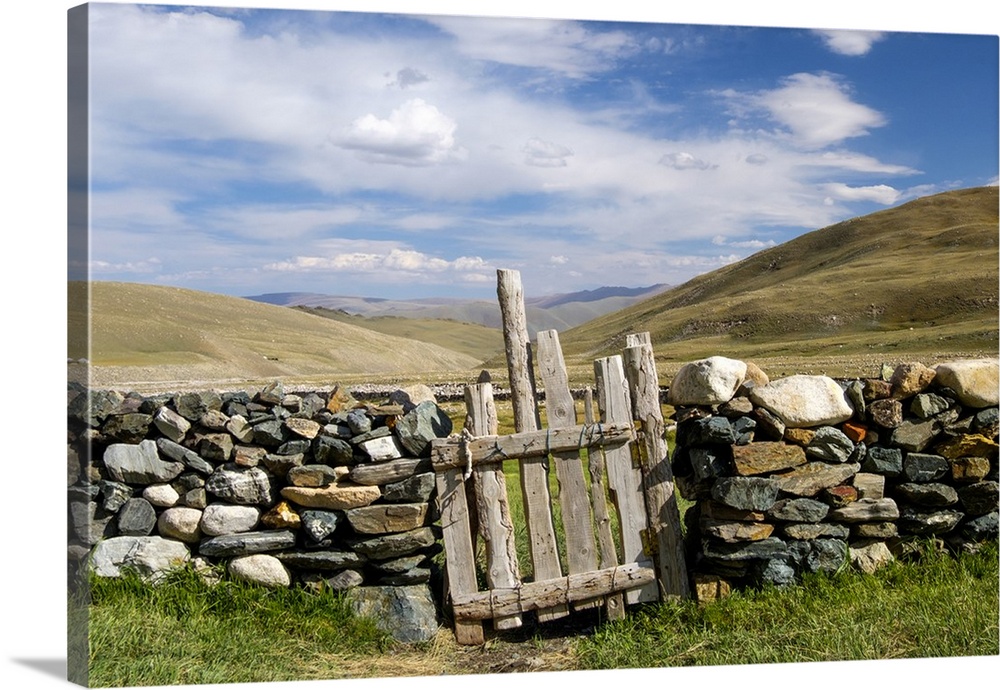 Asia, Western Mongolia, Bayan Olgii Province, Gashuun Suhayt. Stone fence with wooden gate.