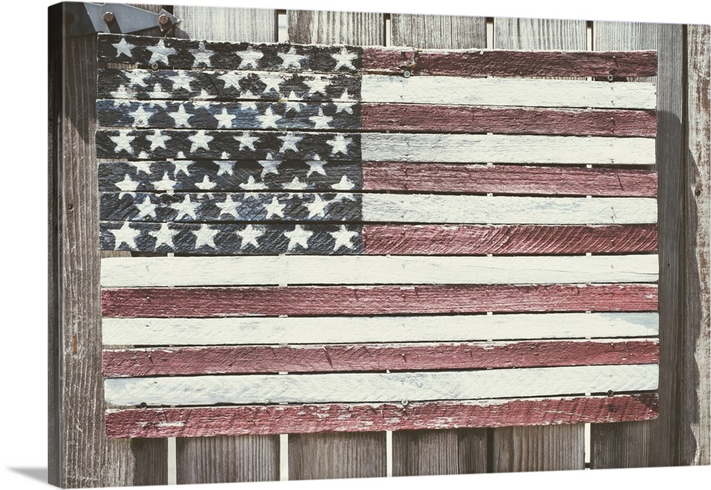 Worn wooden American flag, Fire Island, New York.