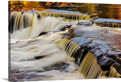 Yellow and golds reflect on the Ontonagon River at Bond Falls Scenic Site, Michigan USA