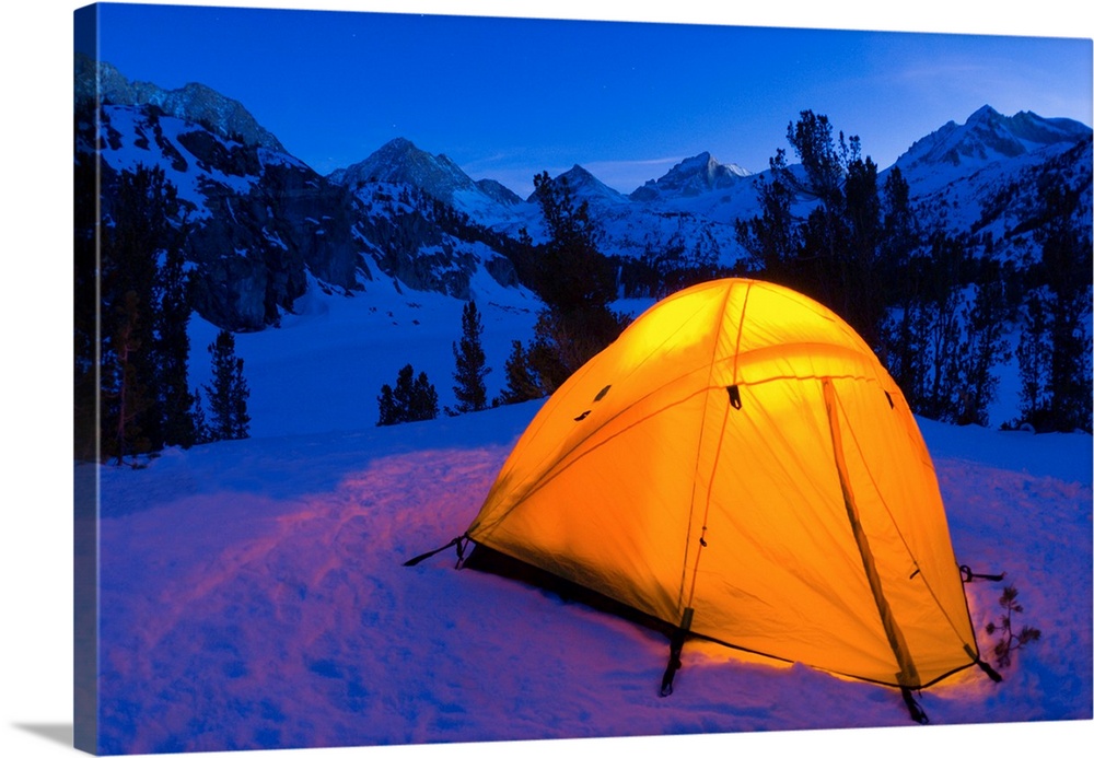 Yellow dome tent in winter, John Muir Wilderness, Sierra Nevada Mountains, California USA.
