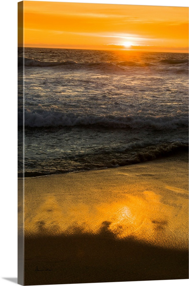 Rocks and Ocean Waves at sunset along the California Coast near Carmel, California, USA.