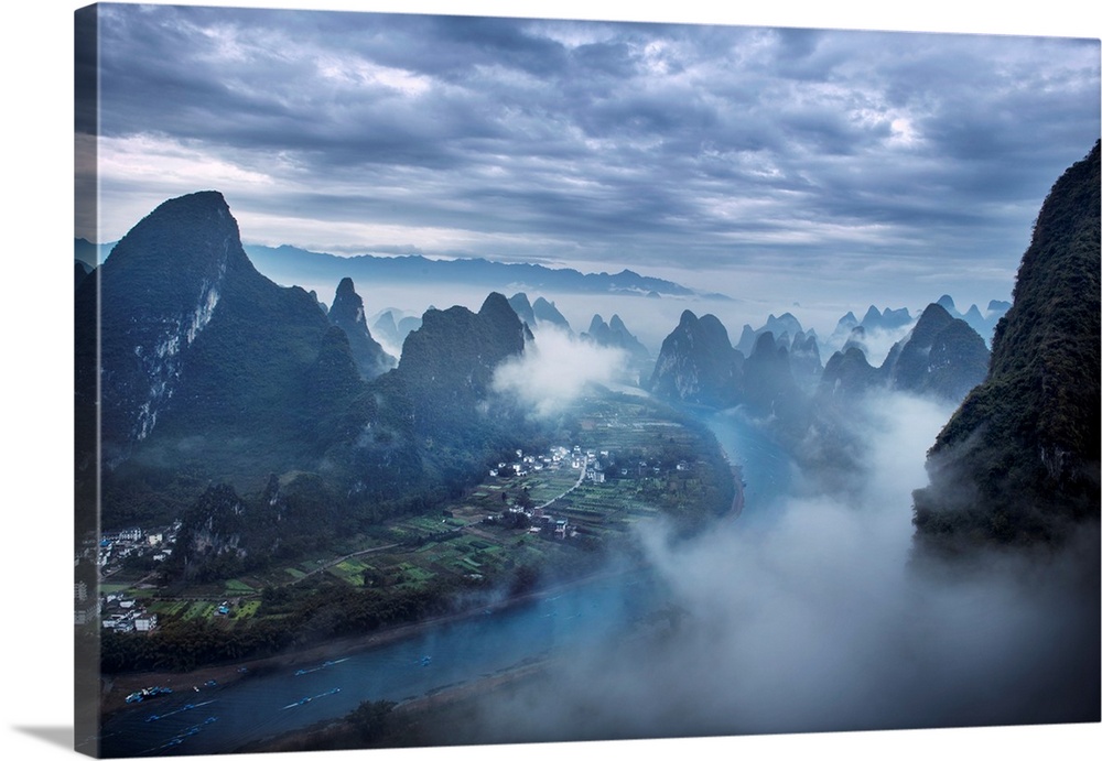 Aerial view of Guilin city, river and mountains in fog, China, Asia.