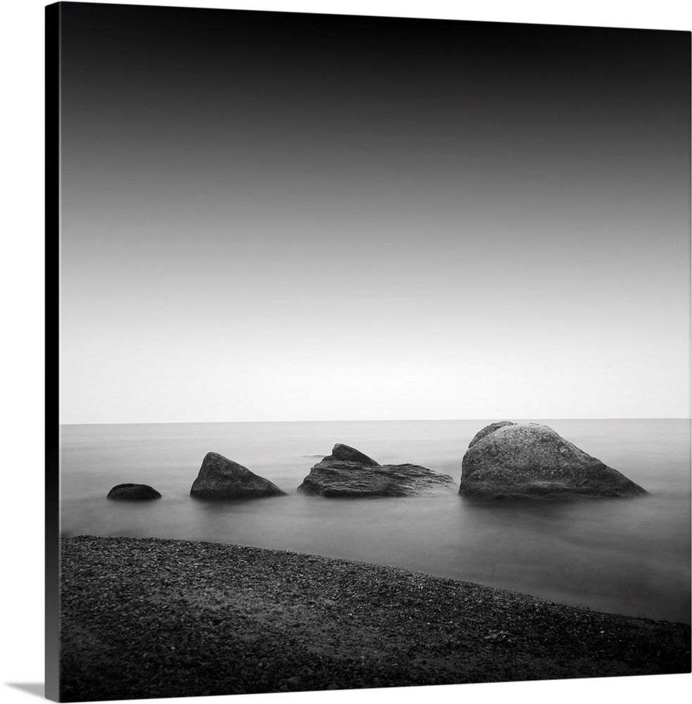 Daytime long exposure seascape with object in the sea. The photo taken in black and white. Black sea, Odessa, Ukraine.