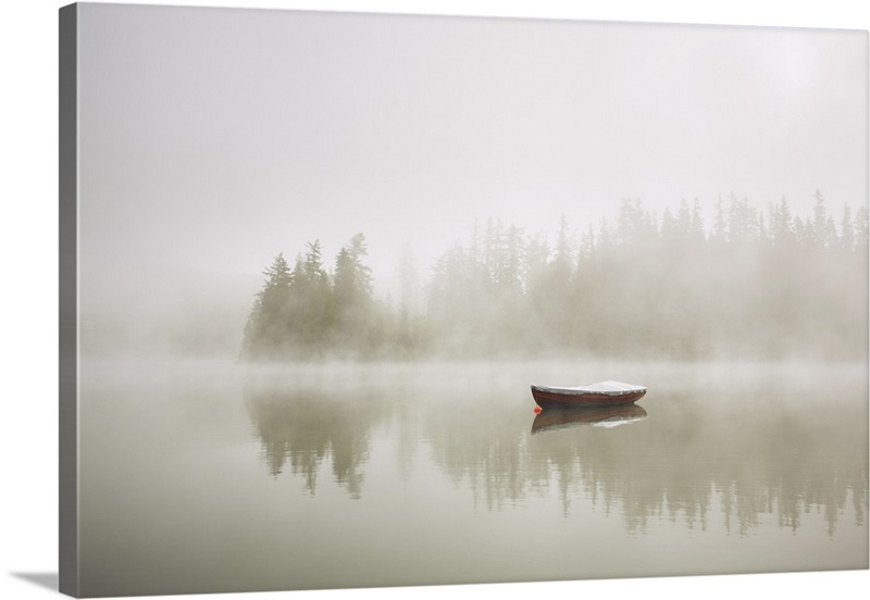 Canvas Print Early morning sunrise, boating on the lake in a huge fog 