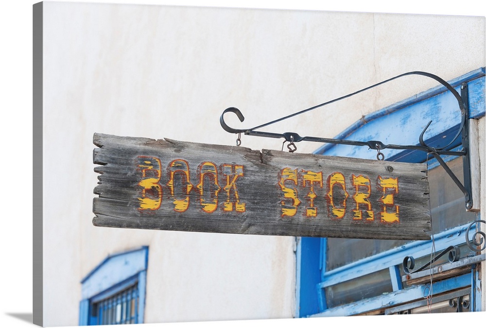 Crafted book store sign in Taos shopping center.