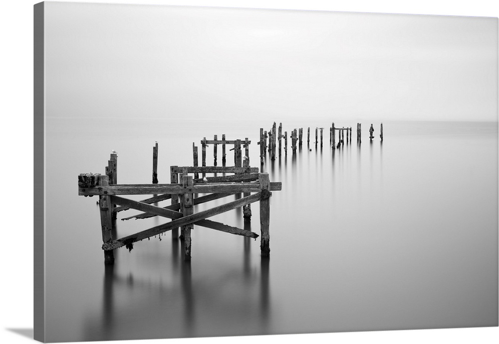 Fine art long exposure landscape of decayed pier.