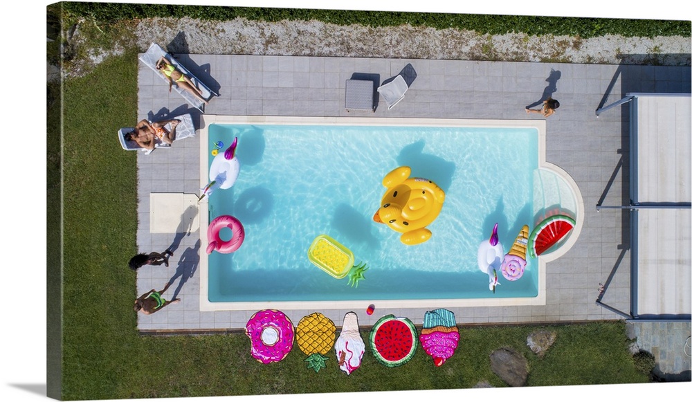 Friends Having Fun In A Swimming Pool