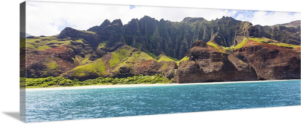 Panorama of dramatic cliffs at Na Pali coast at Kauai, Hawaii, view from water.